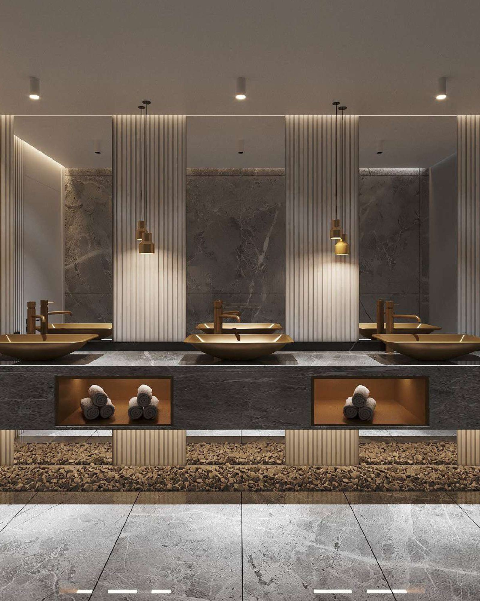 Guest bathroom with three gold vessel basins on a stone counter