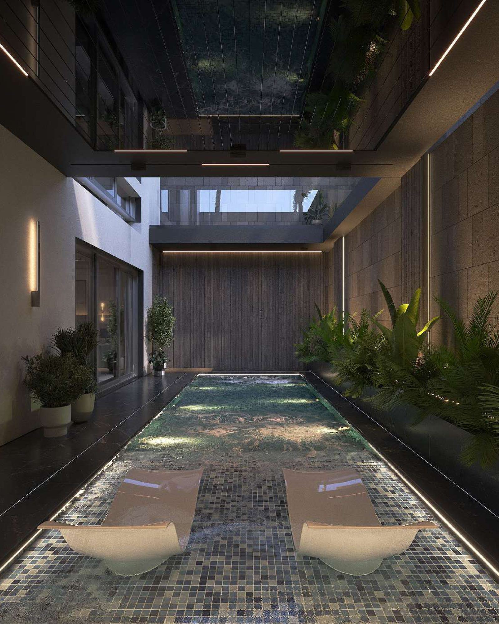 Indoor pool courtyard with loungers, planting and an open skylight